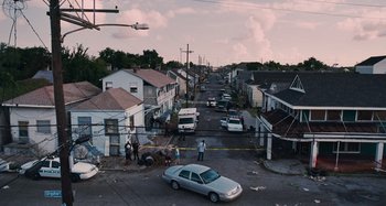 Movie still from “Bad Lieutenant: Port of Call New Orleans” (2009), directed by Werner Herzog – An aerial view of an intersection with a horse drawn carriage; Extreme Wide shot, High angle