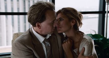Movie still from “Bad Lieutenant: Port of Call New Orleans” (2009), directed by Werner Herzog – A man and a woman kissing in front of a window; Close Up shot, Over the shoulder angle