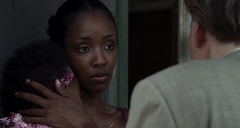 Movie still from “Bad Lieutenant: Port of Call New Orleans” (2009), directed by Werner Herzog – A woman holding a cell phone up to her ear; Close Up shot, Over the shoulder angle