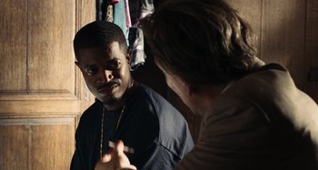 Movie still from “Bad Lieutenant: Port of Call New Orleans” (2009), directed by Werner Herzog – A man talking to another man in a room; Close Up shot, Over the shoulder angle