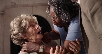 Movie still from “Bad Lieutenant: Port of Call New Orleans” (2009), directed by Werner Herzog – Two women are fighting over a woman's face; Close Up shot, High angle