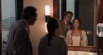 Movie still from “Bad Lieutenant: Port of Call New Orleans” (2009), directed by Werner Herzog – A man and a woman looking in a mirror; Medium shot, Over the shoulder angle