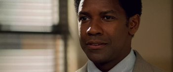 Movie still from “Remember the Titans” (2000), directed by Boaz Yakin – Denzel washington's face in front of a window; Close Up shot, Low angle