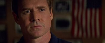 Movie still from “Remember the Titans” (2000), directed by Boaz Yakin – A man's face in the dark; Close Up shot, Over the shoulder angle