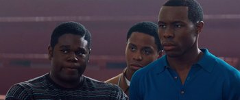 Movie still from “Remember the Titans” (2000), directed by Boaz Yakin – A group of young men standing next to each other; Close Up shot, Low angle