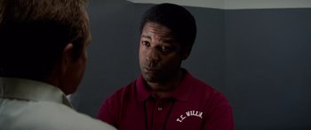 Movie still from “Remember the Titans” (2000), directed by Boaz Yakin – A person wearing a red shirt; Close Up shot, Over the shoulder angle