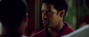 Movie still from “Remember the Titans” (2000), directed by Boaz Yakin – A person wearing a red shirt; Close Up shot, Over the shoulder angle