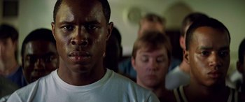 Movie still from “Remember the Titans” (2000), directed by Boaz Yakin – A person on a bus; Close Up shot, Low angle