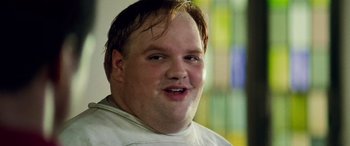 Movie still from “Remember the Titans” (2000), directed by Boaz Yakin – A person with a white shirt on; Close Up shot, Low angle