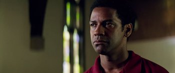Movie still from “Remember the Titans” (2000), directed by Boaz Yakin – A person wearing a red shirt; Close Up shot, Low angle