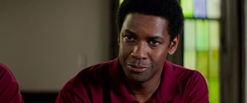 Movie still from “Remember the Titans” (2000), directed by Boaz Yakin – A person wearing a red shirt; Close Up shot, Over the shoulder angle