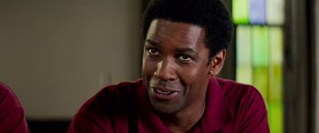 Movie still from “Remember the Titans” (2000), directed by Boaz Yakin – A person wearing a red shirt; Close Up shot, Over the shoulder angle