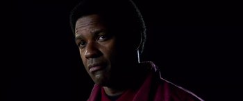 Movie still from “Remember the Titans” (2000), directed by Boaz Yakin – A person wearing a red shirt; Close Up shot, Low angle