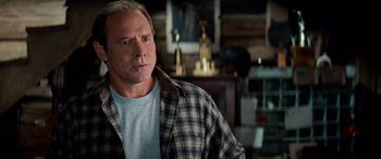 Movie still from “Remember the Titans” (2000), directed by Boaz Yakin – A person wearing a plaid shirt; Close Up shot, Over the shoulder angle