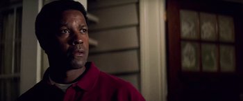 Movie still from “Remember the Titans” (2000), directed by Boaz Yakin – A person wearing a red shirt; Close Up shot, Over the shoulder angle