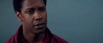 Movie still from “Remember the Titans” (2000), directed by Boaz Yakin – A person wearing a red shirt; Close Up shot, Over the shoulder angle