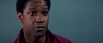 Movie still from “Remember the Titans” (2000), directed by Boaz Yakin – A person wearing a red shirt; Close Up shot, Low angle