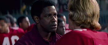 Movie still from “Remember the Titans” (2000), directed by Boaz Yakin – A person talking to another person; Close Up shot, Over the shoulder angle