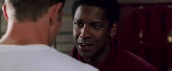 Movie still from “Remember the Titans” (2000), directed by Boaz Yakin – A person talking to another person; Close Up shot, Over the shoulder angle