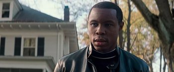 Movie still from “Remember the Titans” (2000), directed by Boaz Yakin – A person wearing a leather jacket; Close Up shot, Over the shoulder angle