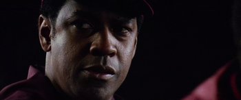 Movie still from “Remember the Titans” (2000), directed by Boaz Yakin – A person wearing a hat; Close Up shot, Low angle