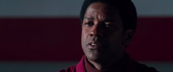 Movie still from “Remember the Titans” (2000), directed by Boaz Yakin – A person wearing a red shirt; Close Up shot, Low angle