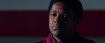Movie still from “Remember the Titans” (2000), directed by Boaz Yakin – A person wearing a red shirt; Close Up shot, Low angle