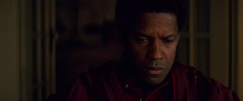 Movie still from “Remember the Titans” (2000), directed by Boaz Yakin – A person wearing a red shirt; Close Up shot, Over the shoulder angle