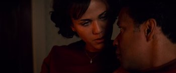 Movie still from “Remember the Titans” (2000), directed by Boaz Yakin – A person with a cross on her neck; Close Up shot, Over the shoulder angle