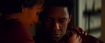 Movie still from “Remember the Titans” (2000), directed by Boaz Yakin – A man and a woman looking at one another; Close Up shot, High angle