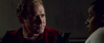 Movie still from “Remember the Titans” (2000), directed by Boaz Yakin – A person wearing a jacket; Close Up shot, Over the shoulder angle