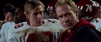 Movie still from “Remember the Titans” (2000), directed by Boaz Yakin – Two football players and a coach in a huddle; Close Up shot, Over the shoulder angle