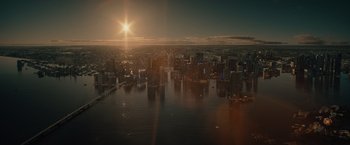 Movie still from “Reminiscence” (2021), directed by Lisa Joy – An aerial view of a large city at sunset; Extreme Wide shot, High angle