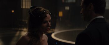 Movie still from “Reminiscence” (2021), directed by Lisa Joy – A beautiful woman wearing a crown in a dark room; Close Up shot, Over the shoulder angle