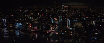 Movie still from “Reminiscence” (2021), directed by Lisa Joy – An aerial view of a city lit up at night; Extreme Wide shot, High angle
