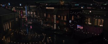 Movie still from “Reminiscence” (2021), directed by Lisa Joy – A view of a city lit up at night with lights; Extreme Wide shot, High angle