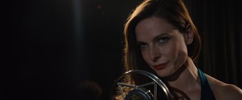 Movie still from “Reminiscence” (2021), directed by Lisa Joy – A beautiful woman with red lipstick looking at the camera; Close Up shot, Low angle