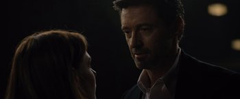 Movie still from “Reminiscence” (2021), directed by Lisa Joy – A man and a woman face to face in the dark; Close Up shot, Over the shoulder angle