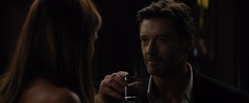 Movie still from “Reminiscence” (2021), directed by Lisa Joy – A man and a woman holding a glass of wine; Close Up shot, Over the shoulder angle