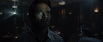 Movie still from “Reminiscence” (2021), directed by Lisa Joy – A person wearing a dress shirt and tie; Close Up shot, Low angle