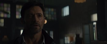 Movie still from “Reminiscence” (2021), directed by Lisa Joy – A person wearing a jacket; Close Up shot, Over the shoulder angle