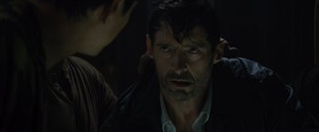 Movie still from “Reminiscence” (2021), directed by Lisa Joy – A person wearing a jacket; Close Up shot, Over the shoulder angle