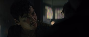 Movie still from “Reminiscence” (2021), directed by Lisa Joy – A person sitting in front of a window; Close Up shot, Over the shoulder angle