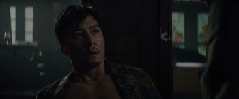 Movie still from “Reminiscence” (2021), directed by Lisa Joy – A person wearing a robe; Close Up shot, Low angle