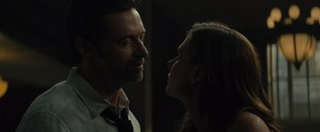 Movie still from “Reminiscence” (2021), directed by Lisa Joy – A man and a woman looking at each other in the dark; Close Up shot, Low angle