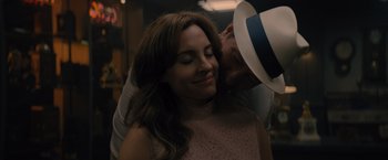 Movie still from “Reminiscence” (2021), directed by Lisa Joy – A man kissing a woman on the cheek; Close Up shot, Over the shoulder angle