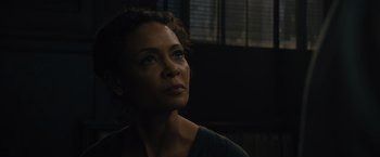 Movie still from “Reminiscence” (2021), directed by Lisa Joy – A person looking at something in the dark; Close Up shot, Low angle