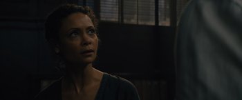 Movie still from “Reminiscence” (2021), directed by Lisa Joy – A person looking at something; Close Up shot, Over the shoulder angle