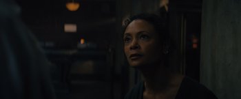 Movie still from “Reminiscence” (2021), directed by Lisa Joy – A woman is looking out a window at night; Close Up shot, Low angle