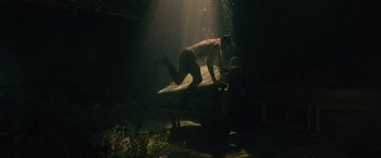 Movie still from “Reminiscence” (2021), directed by Lisa Joy – A man diving into the water from a boat; Wide shot, High angle